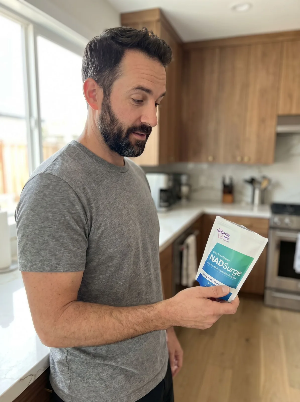 Customer holding NAD Surge in the kitchen